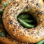 Everything bagel with crispy green beans inside, topped with sesame seeds, poppy seeds, and garlic.